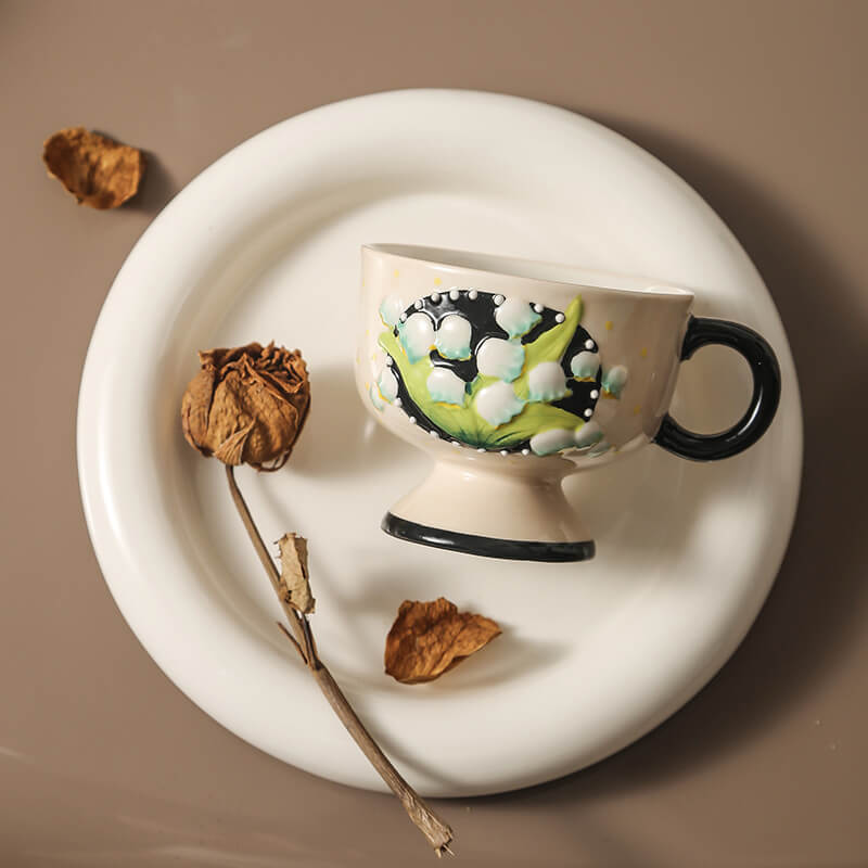 Hand-painted lily-of-the-valley ceramic cup