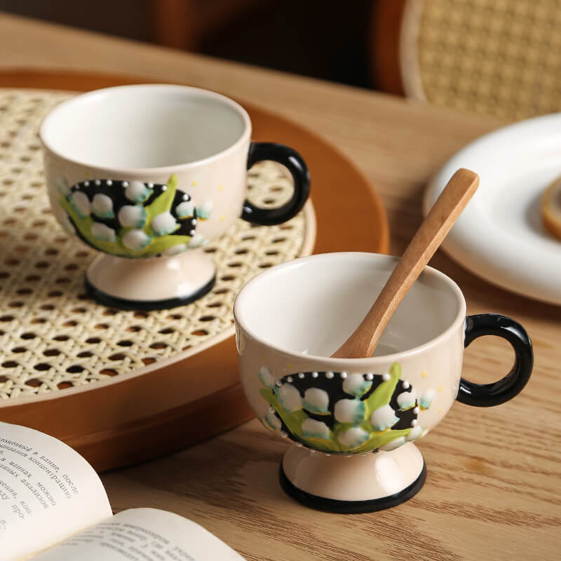 Hand-painted lily-of-the-valley ceramic cup