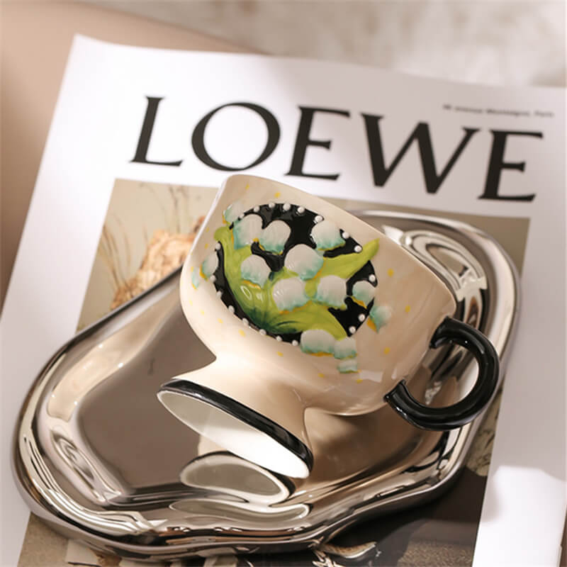 Hand-painted lily-of-the-valley ceramic cup
