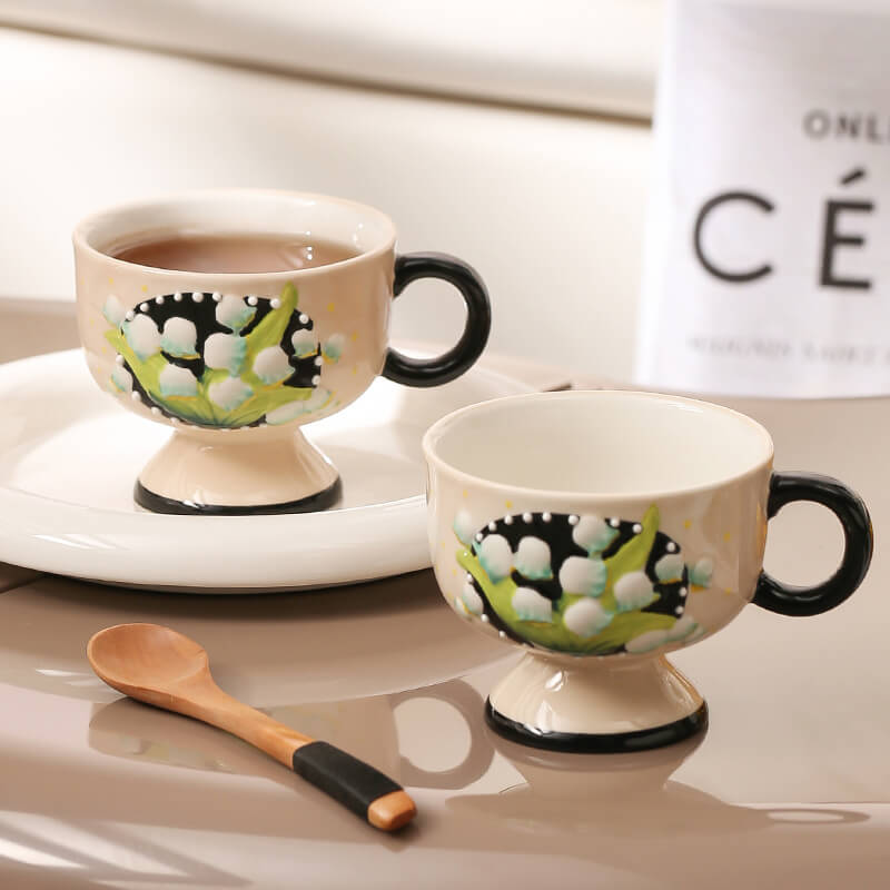 Hand-painted lily-of-the-valley ceramic cup